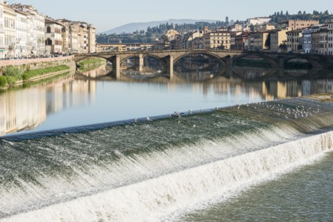 Italy, Tuscany, Florence, Cityscape reflected in Arno river