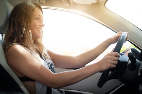 Happy woman driving
