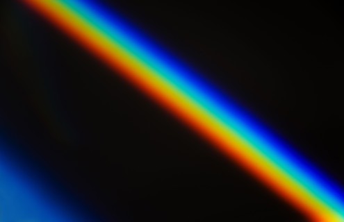 Rainbow light against black