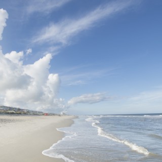 Clouds above beach and sea