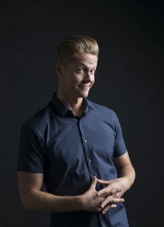Portrait of man frowning and smiling