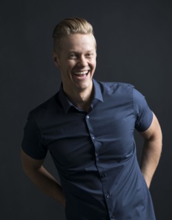 Portrait of blond man laughing