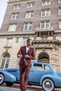 USA, Utah, Salt Lake city, Elegant man crossing street, vintage car in background