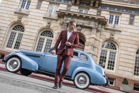USA, Utah, Salt Lake city, Elegant man crossing street, vintage car in background