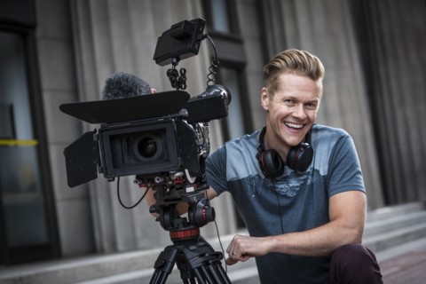 Portrait of smiling camera operator