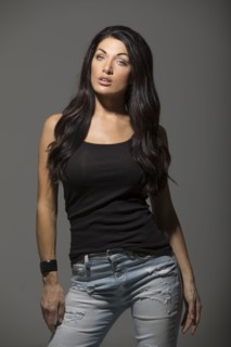 Portrait of brunette woman wearing black tank top