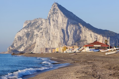 UK, Rock of Gibraltar with sandy beach in foreground