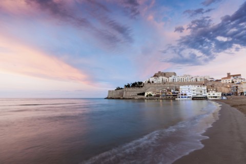 Spain, Valencian Community, Peniscola, Waterfront town at sunset