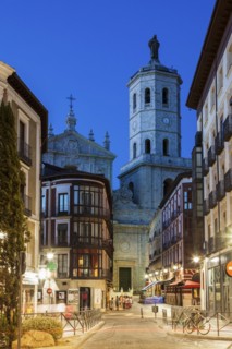 Spain, Castile and Leon, Valladolid, City street with Cathedral of Valladolid in background