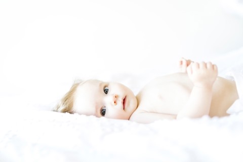 Portrait of baby girl (6-11 Months) looking at camera