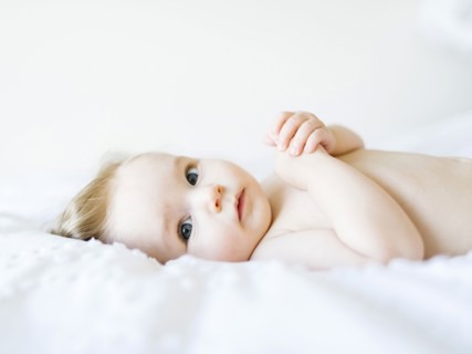 Portrait of baby girl (6-11 Months) looking at camera