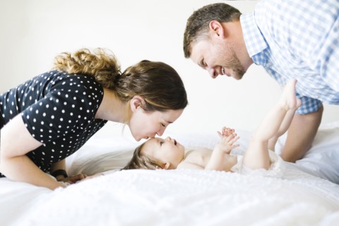 Baby girl (6-11 Months) spending time with parents