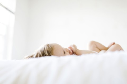 Baby girl (6-11 months) playing in bedroom