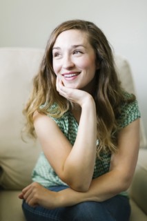 Portrait of woman sitting in living room
