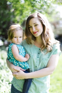 Portrait of mother and baby girl (12-17 months) in backyard