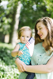 Portrait of mother and baby girl (12-17 months) in backyard