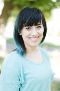 Portrait of smiling woman with blue ombre hair