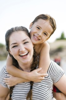 Portrait of smiling mother with son (6-7)