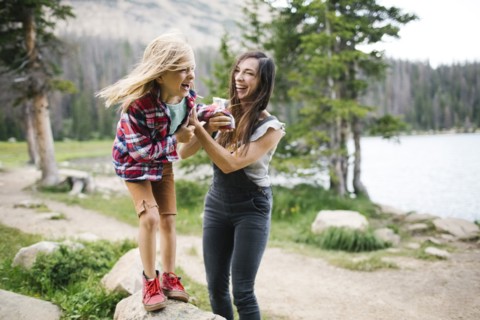 USA, Utah, Midway, Mother playing with son (6-7) by lake in forest