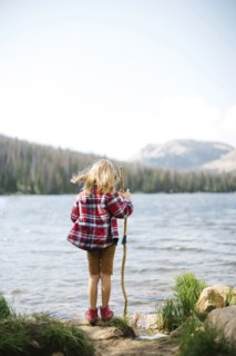 USA, Utah, Midway, Rear view of boy (6-7) standing by lake