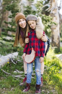 Portrait of mother with son (6-7) hiking in forest