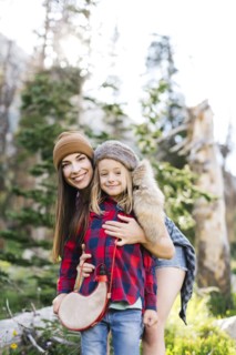 Portrait of mother with son (6-7) hiking in forest