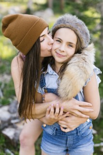 Portrait of mother with daughter (8-9) hiking in forest