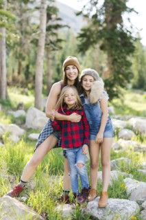 Portrait of mother with son (6-7) and daughter (8-9) hiking in forest