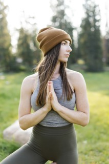 Woman practicing yoga in forest