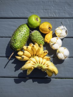 Fruit and ice creams on black floor