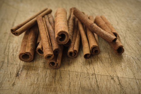 Cinnamon sticks on wooden table