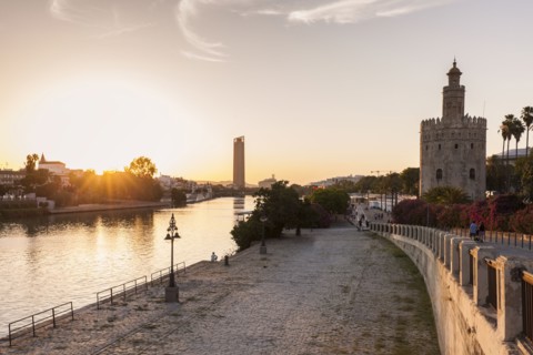 Spain, Andalusia, Seville, Golden Tower against sunrise
