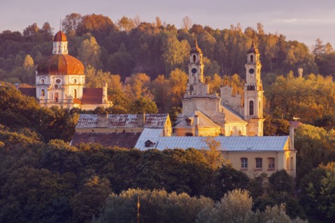 Lithuania, Vilnius, morning view of churches among trees