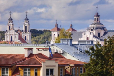 Lithuania, Vilnius, Residential building with churches in background
