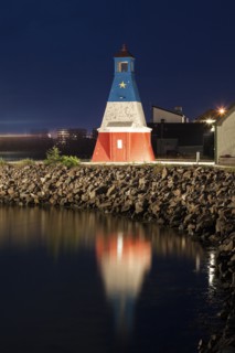 Canada, Nova Scotia, Cheticamp, Lighthouse reflecting in water
