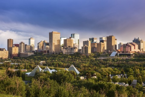 Canada, Alberta, Edmonton, Cityscape with trees in foreground