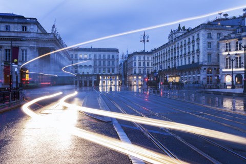 France, Nouvelle-Aquitaine, Bordeaux, City street at dusk