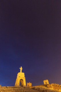 Spain, Andalusia, Almeria, Statue of Sacred Heart of Jesus at dusk