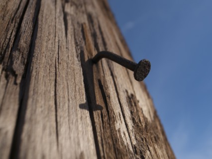 Bent nail in wood