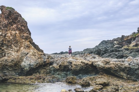 Australia, New South Wales, Woman standing on cliff and looking at view