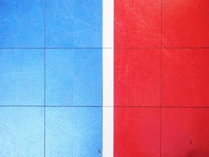 Red and blue tiled floor of basketball court