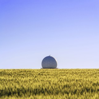 Ukraine, Dnepropetrovsk region, Dnepropetrovsk city, Radar in middle of field of wheat