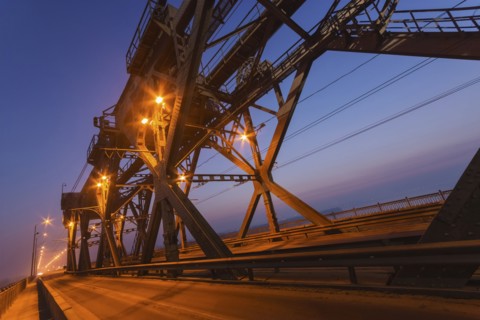 Ukraine, Dnepropetrovsk region, Dnepropetrovsk city, Illuminated bridge at dusk