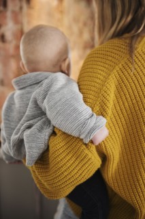 Mother holding baby boy (12-17 months)