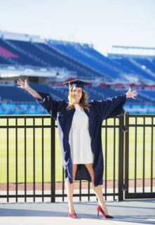 Portrait of graduate student in stadium