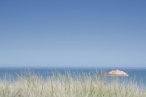 Clear sky above beach umbrella in beach