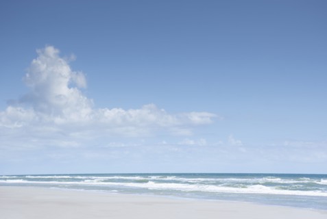 Blue sky and clouds above sea