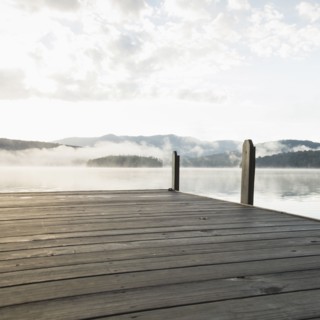 USA, New York, Lake Placid, Pier with foggy lake in background