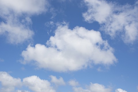 White cumulus clouds on blue sky