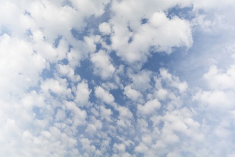 White cumulus clouds on blue sky